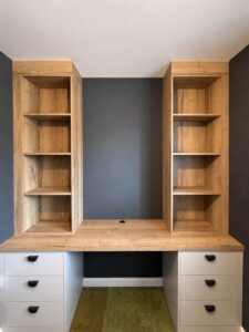 Built-in home office cabinet with hidden cable management and filing drawers