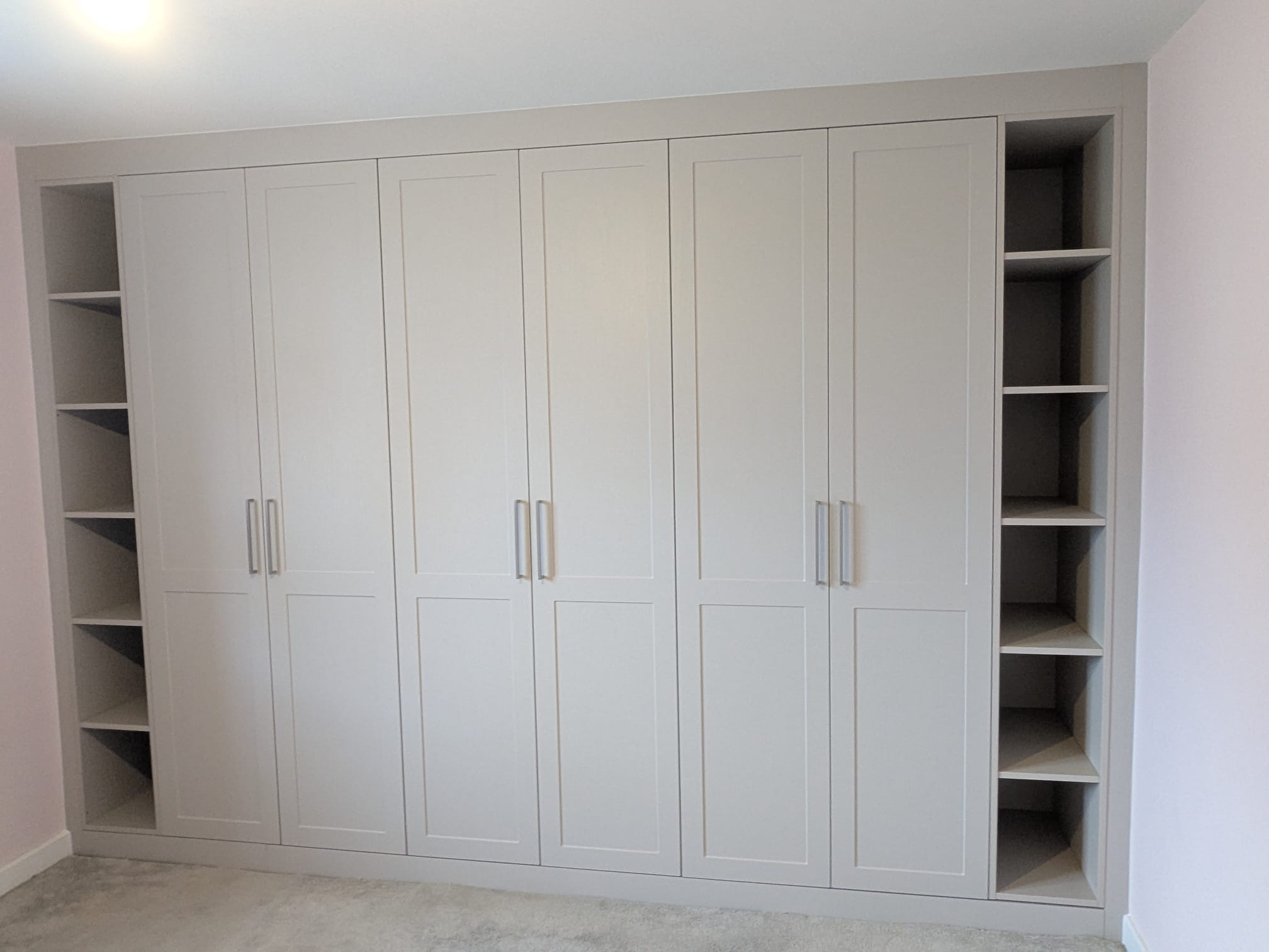 Bespoke shaker-style fitted wardrobe wall built for a Morpeth home by Interiors By Build NE