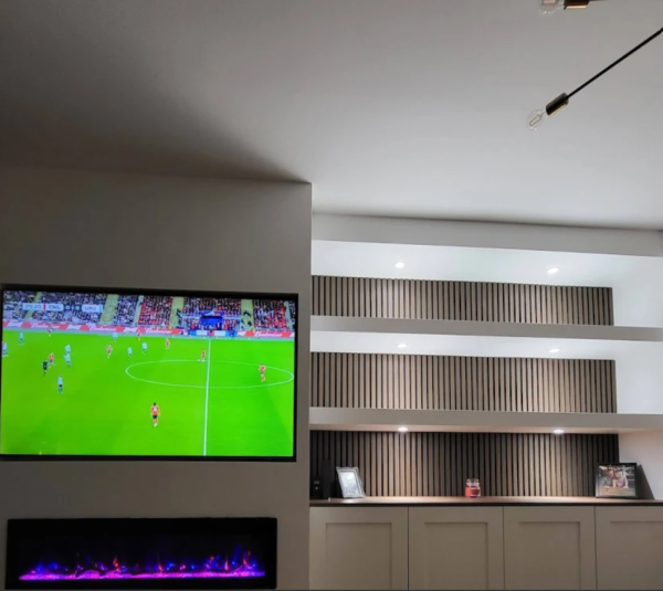 Custom media wall with TV housing designed and built by Interiors by Build NE, North East — reviewed by Samantha Scullion