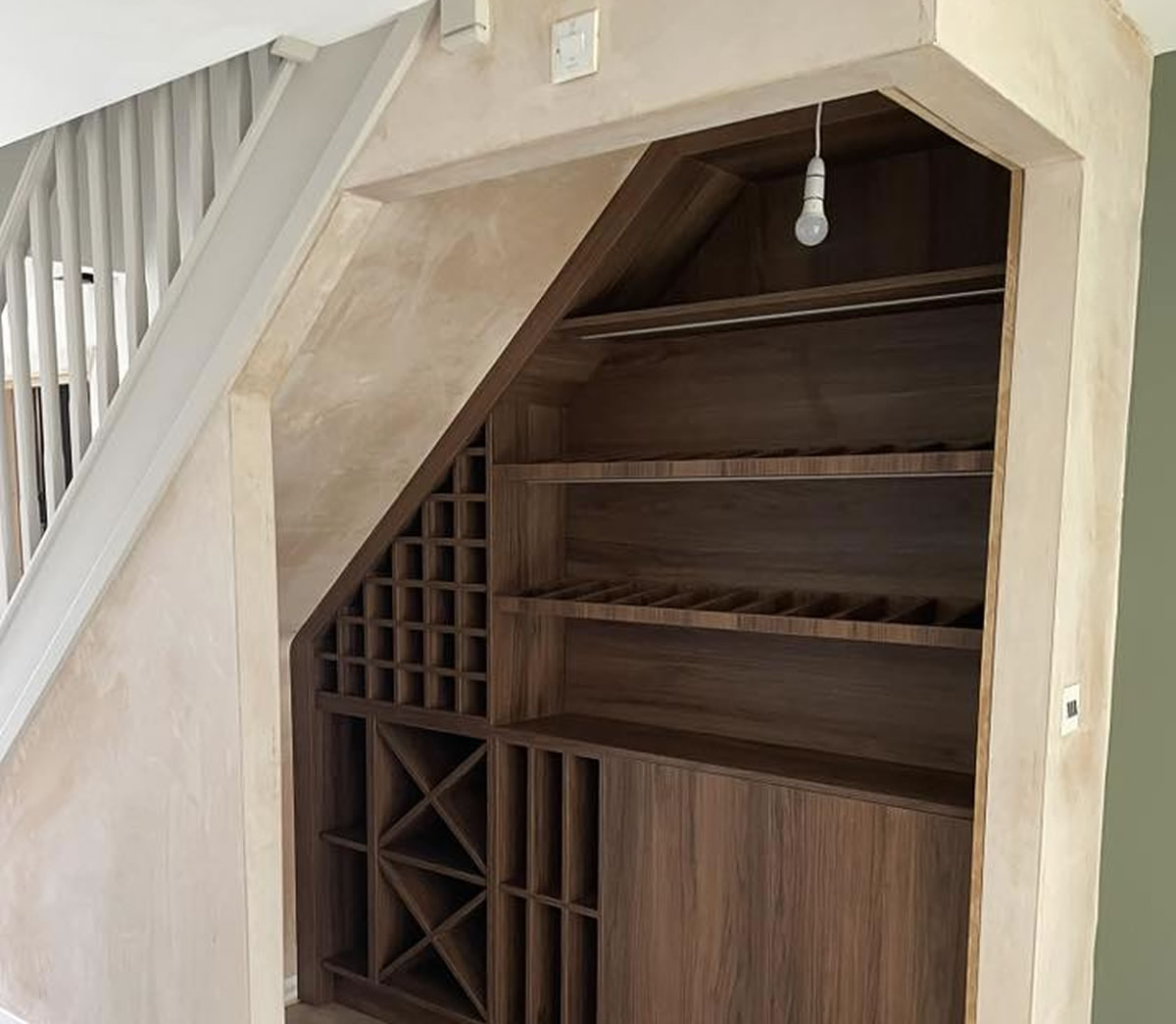 Bespoke under-stairs wine storage fitted in a Bedlington home by Interiors By Build NE