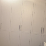 Bespoke bedroom wardrobes with integrated shelving and hanging space by Interiors by Build NE, NE12