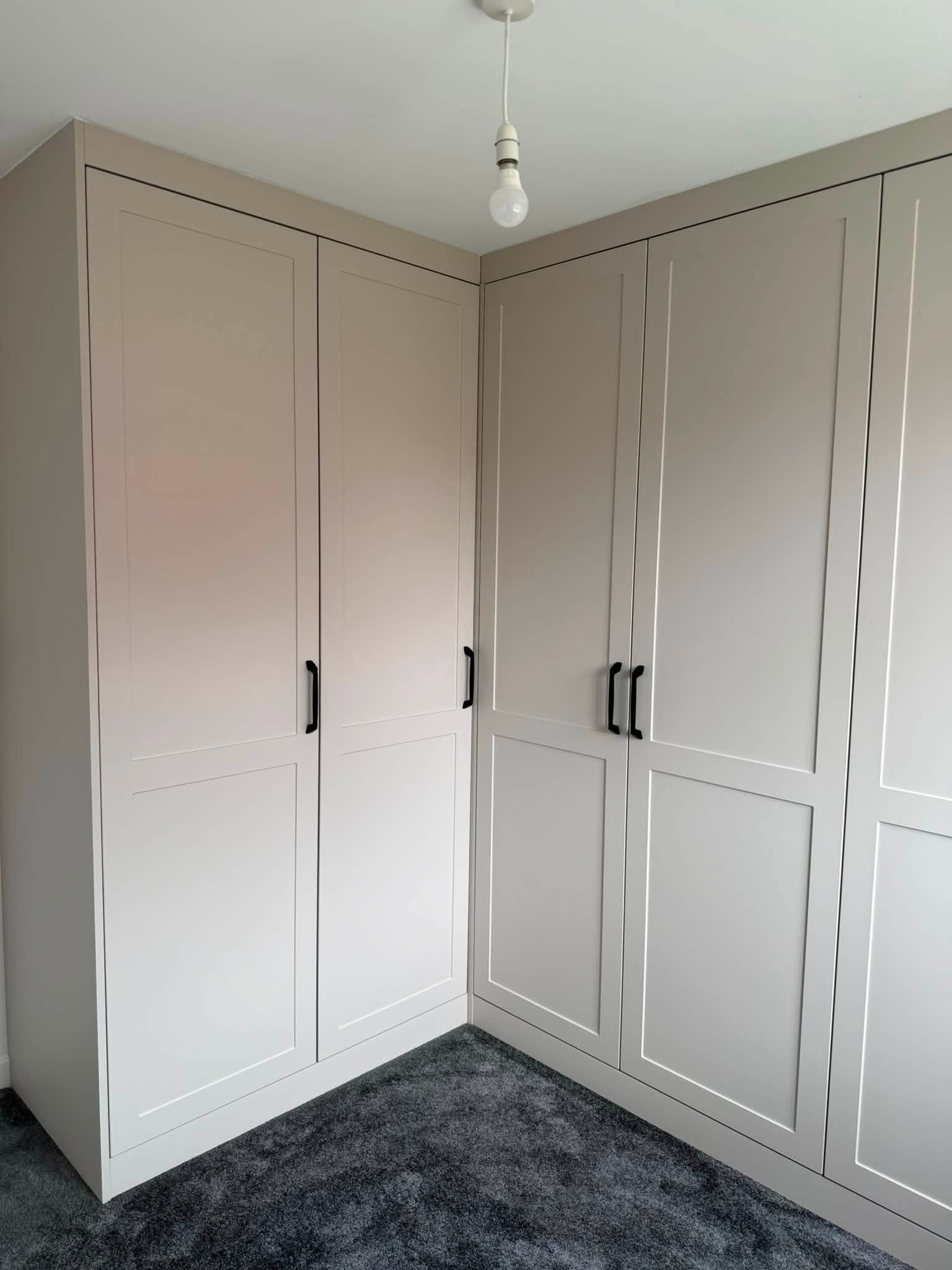 Fitted corner wardrobes with shaker doors, installed by Interiors by Build NE