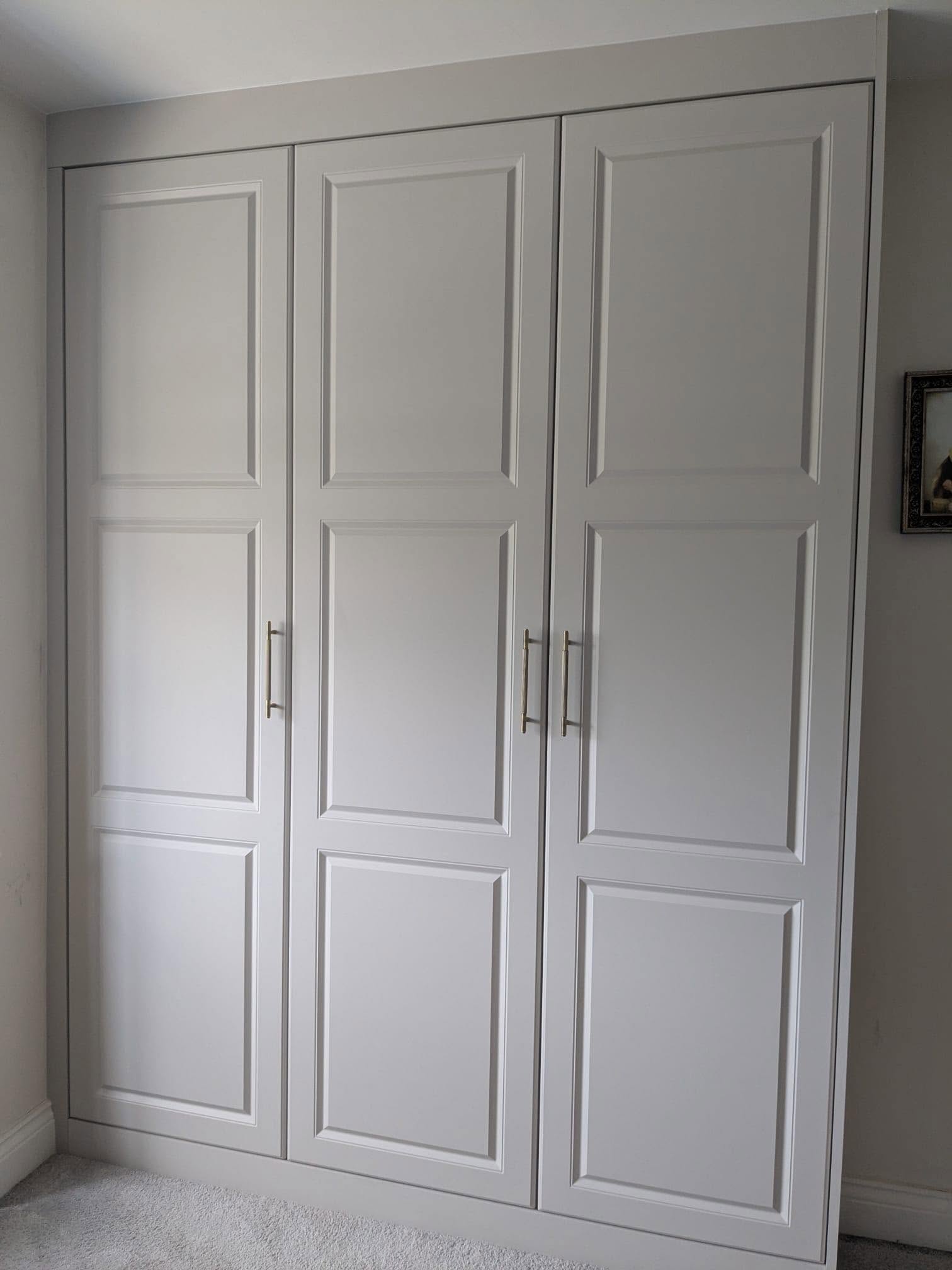 Bespoke fitted wardrobe with shaker-style doors, installed by Interiors by Build NE in Cramlington