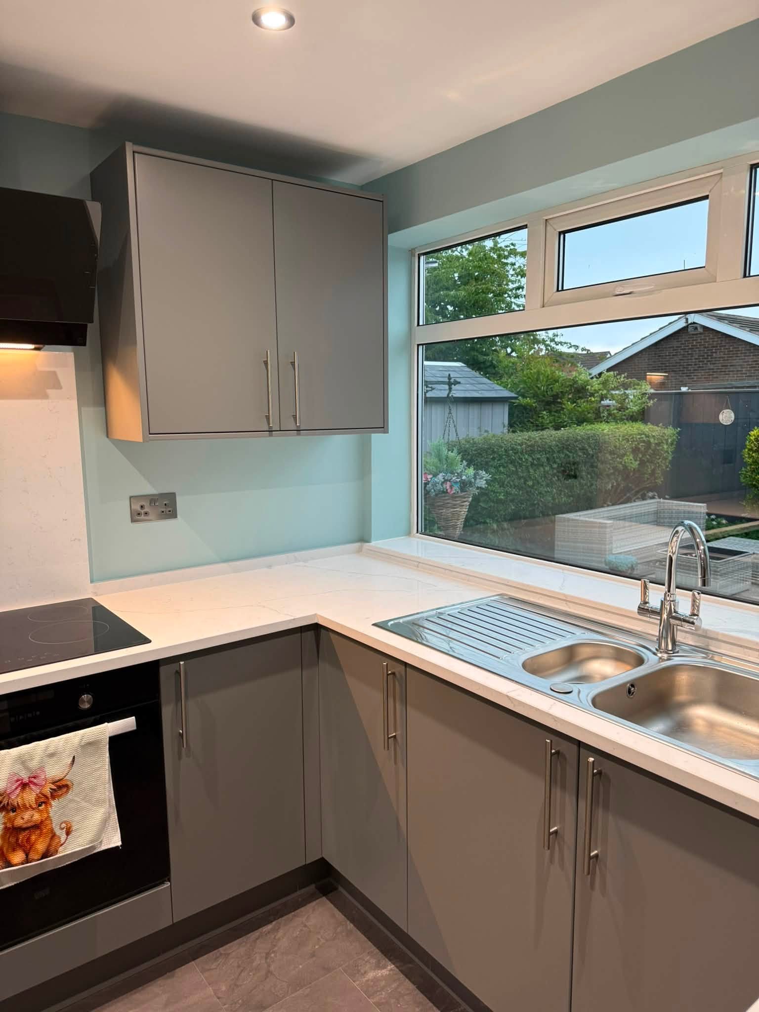 Custom fitted kitchen with quartz worktops, installed by Interiors by Build NE in Cramlington