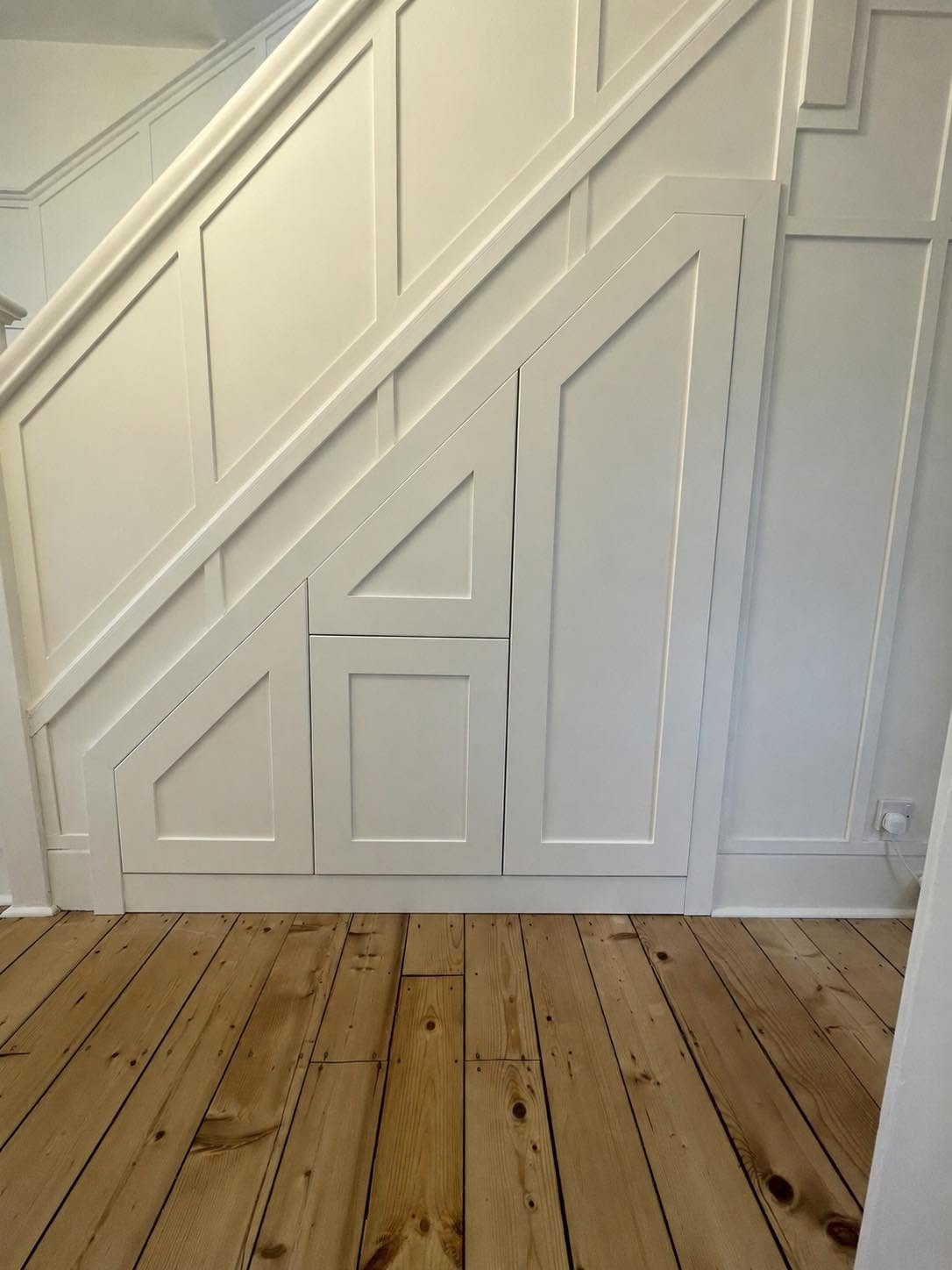 Bespoke under-stairs storage cupboards, installed by Interiors by Build NE in Gosforth